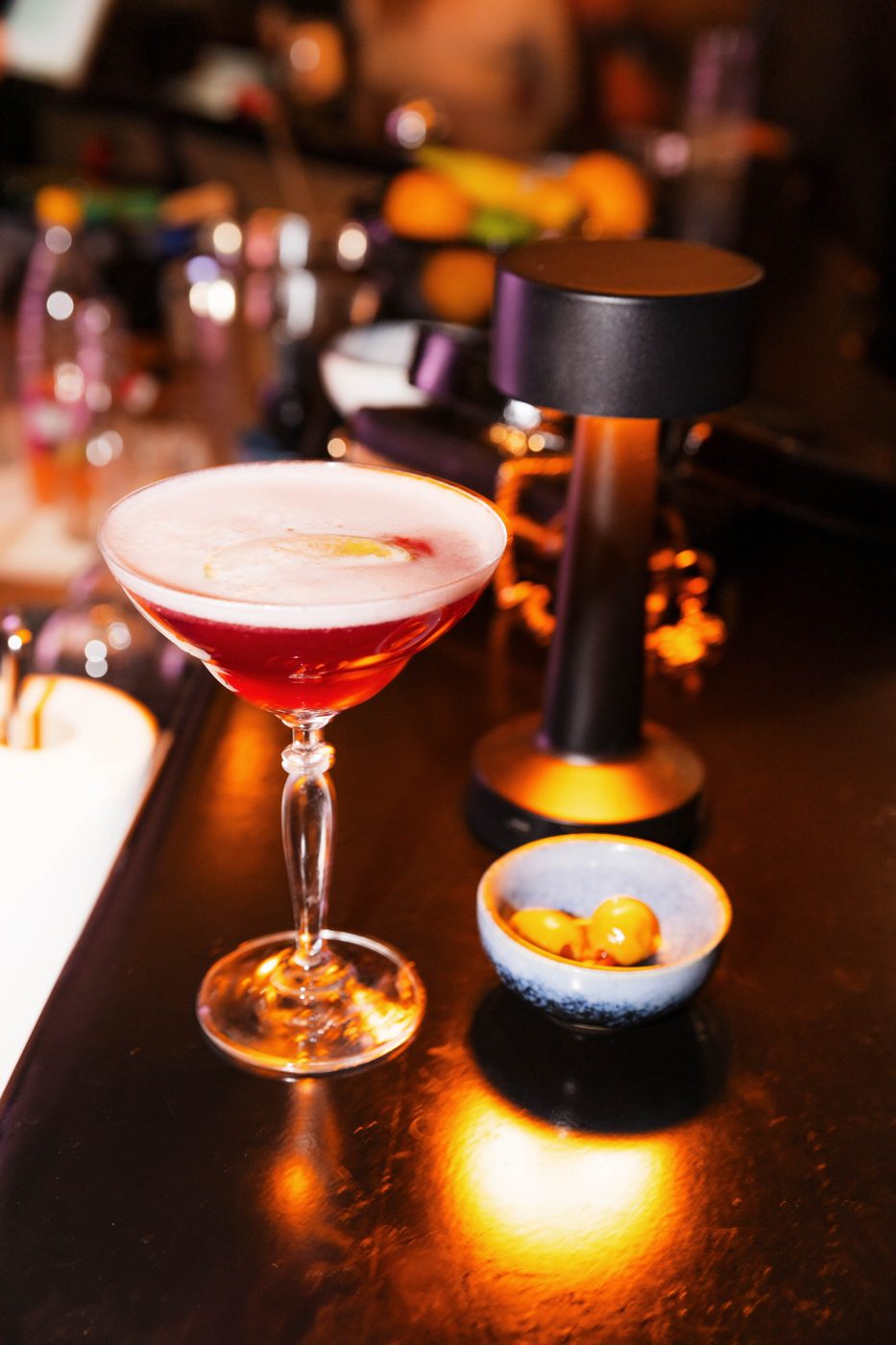 A red cocktail on the bar at RABOTEKA